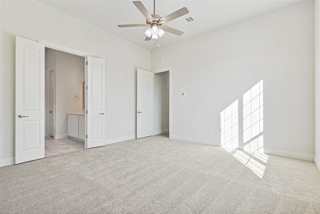 unfurnished bedroom with light carpet and ceiling fan