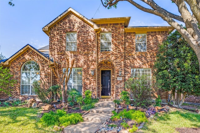 front facade featuring a front lawn