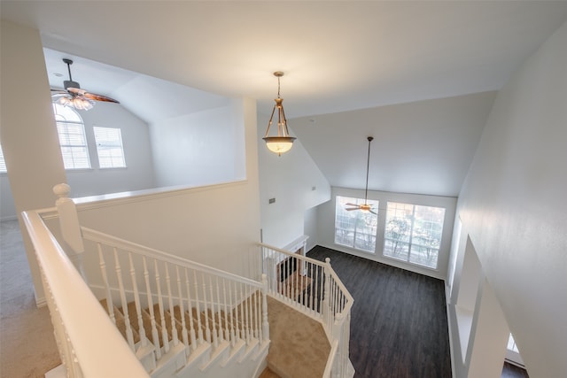 staircase featuring ceiling fan and vaulted ceiling