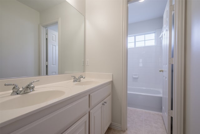 bathroom featuring bathtub / shower combination and vanity