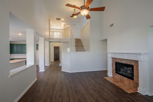 spare room featuring dark wood-type flooring, ceiling fan, and ornamental molding