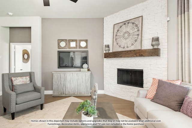 living room featuring ceiling fan, radiator, a fireplace, and hardwood / wood-style floors