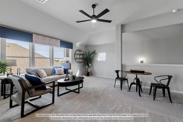 living room featuring ceiling fan, lofted ceiling, and light carpet