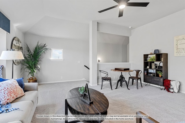 carpeted living room with ceiling fan and lofted ceiling