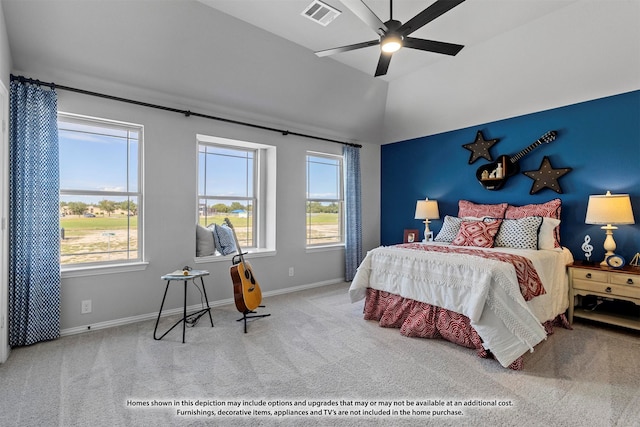 carpeted bedroom featuring ceiling fan and multiple windows