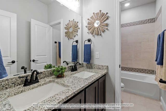 full bathroom with tiled shower / bath combo, tile patterned flooring, vanity, and toilet