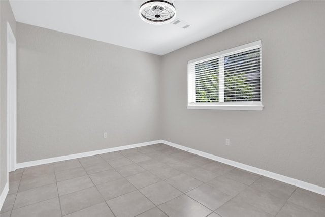 empty room with light tile patterned floors