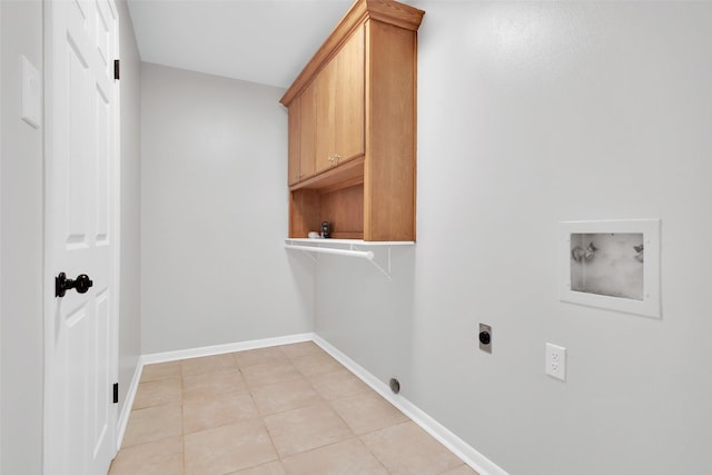 laundry area featuring cabinets, washer hookup, electric dryer hookup, and light tile patterned flooring