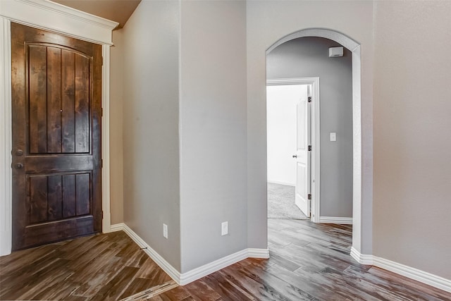 foyer entrance featuring dark hardwood / wood-style floors