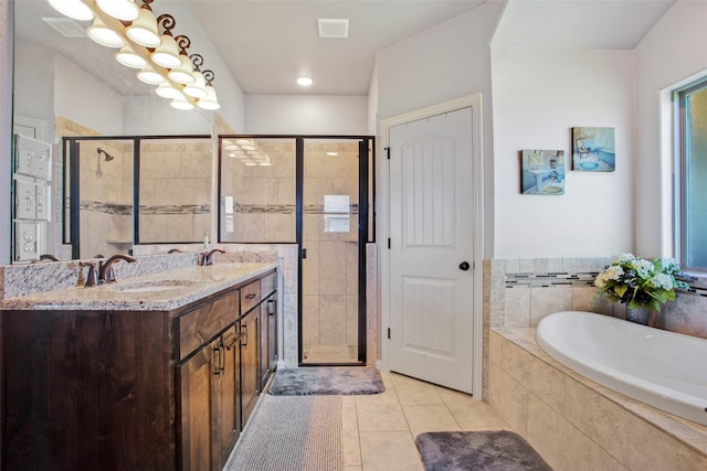 bathroom featuring tile patterned flooring, vanity, and plus walk in shower