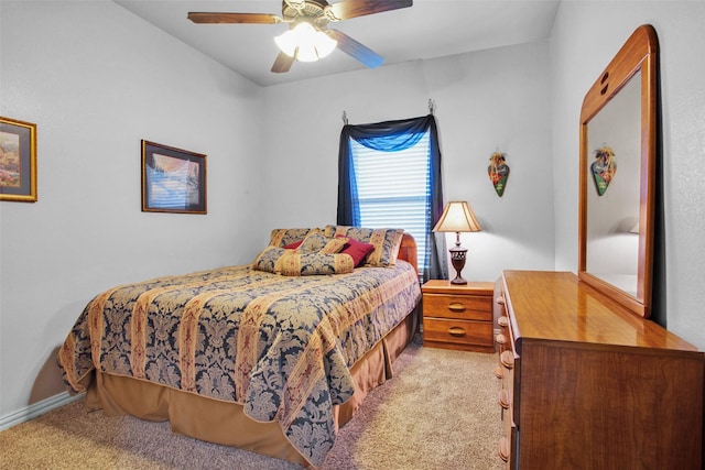 bedroom featuring ceiling fan and light colored carpet