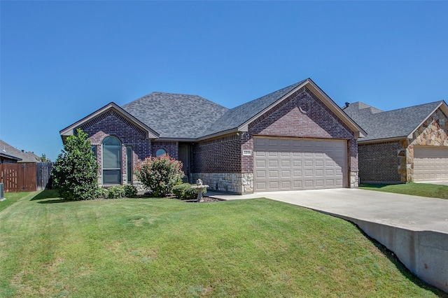 view of front of house featuring a garage and a front yard