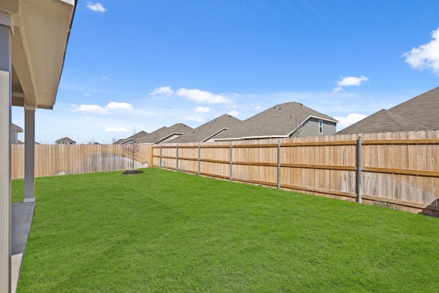 view of yard with a fenced backyard