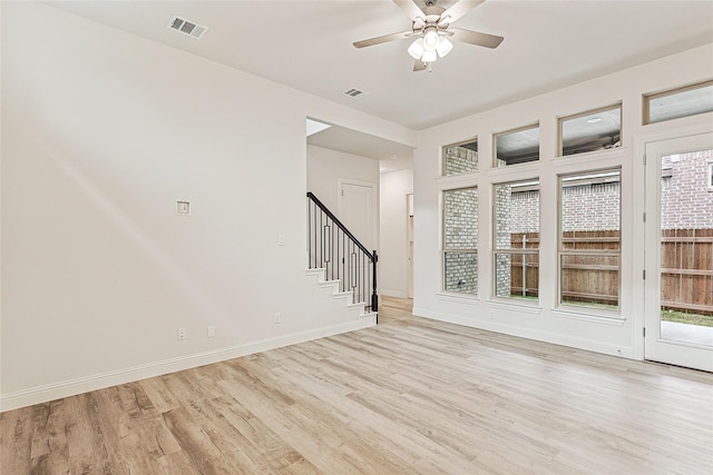 spare room featuring ceiling fan and light wood-type flooring