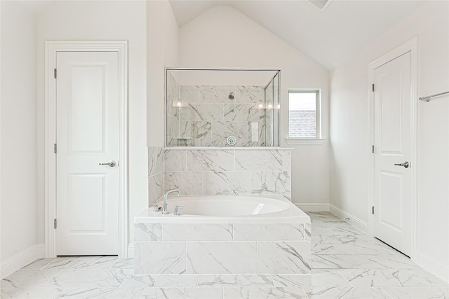 bathroom featuring separate shower and tub and lofted ceiling