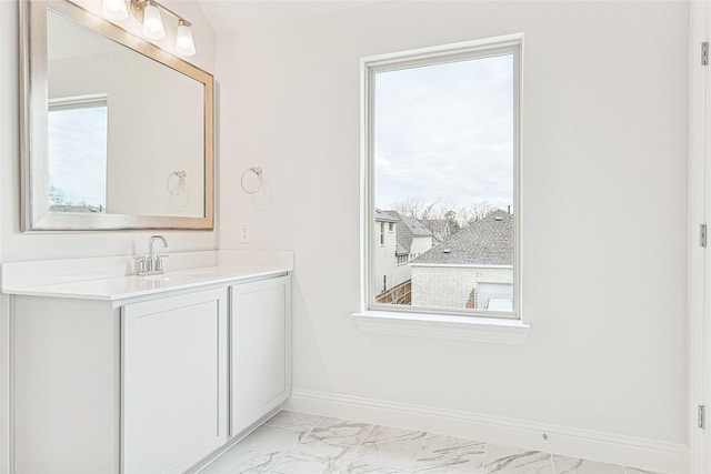 bathroom with vanity and a wealth of natural light