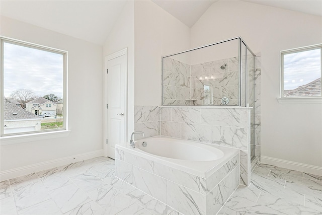 bathroom with shower with separate bathtub and lofted ceiling