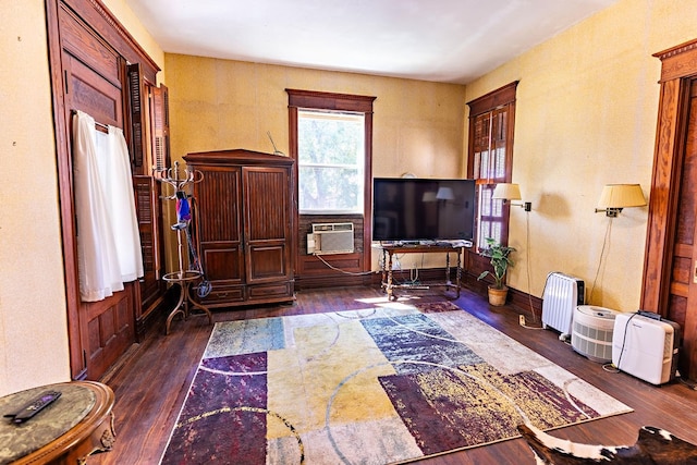 interior space featuring cooling unit and dark wood-type flooring