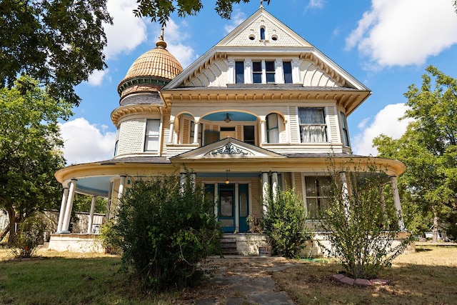 victorian-style house featuring covered porch