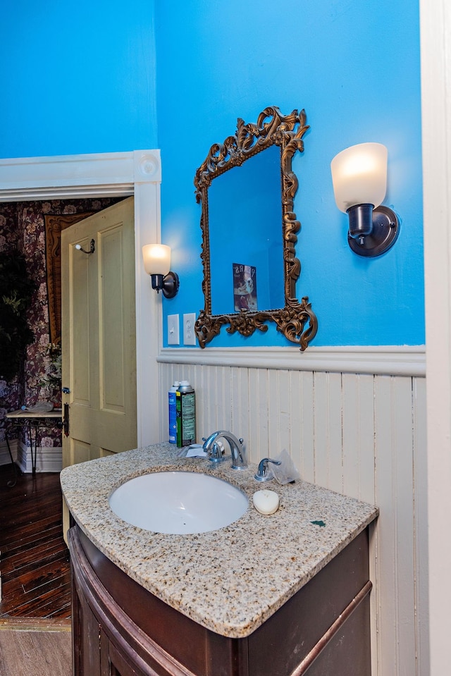 bathroom with vanity and hardwood / wood-style floors