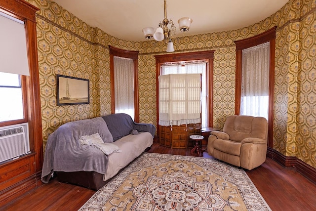 living room with hardwood / wood-style floors and a chandelier