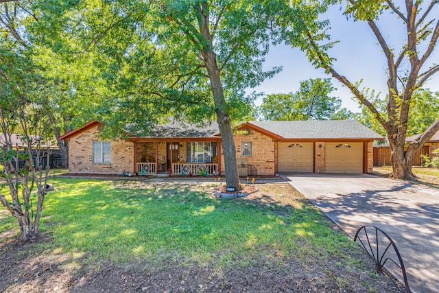 single story home featuring a garage, a porch, and a front lawn