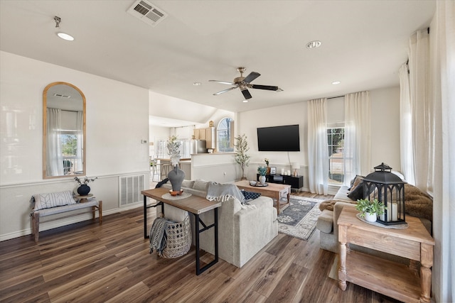 living room featuring ceiling fan, a healthy amount of sunlight, lofted ceiling, and hardwood / wood-style floors