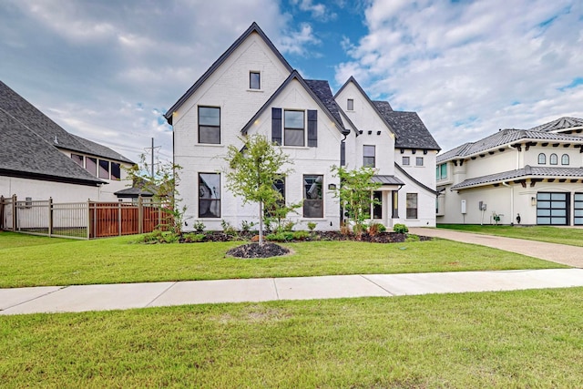 view of front facade with a front lawn and a garage