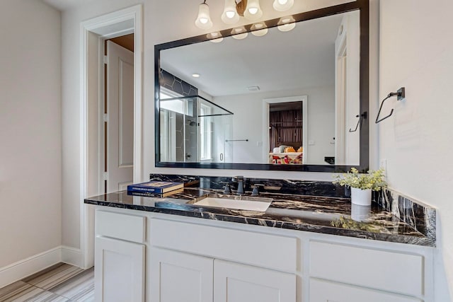 bathroom with vanity and walk in shower