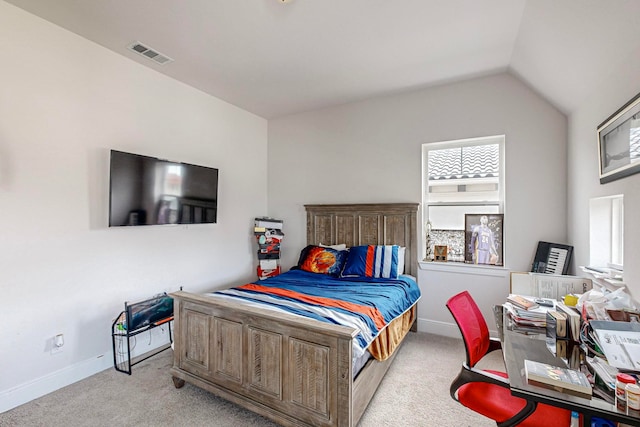 carpeted bedroom featuring lofted ceiling