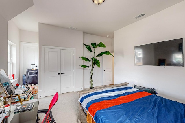 bedroom with a closet and carpet floors