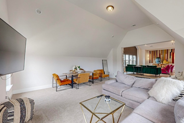 living room featuring vaulted ceiling and light carpet