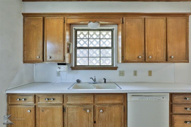 kitchen featuring white dishwasher and sink