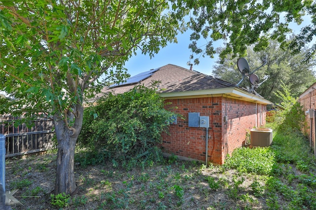 view of side of property with cooling unit