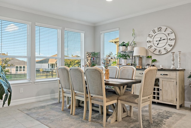 dining area with ornamental molding and light tile patterned floors