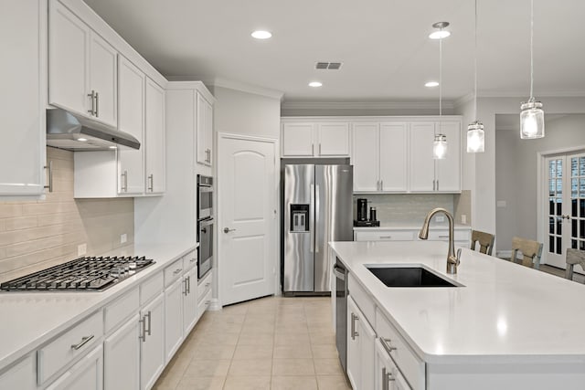 kitchen with a center island with sink, sink, white cabinetry, and stainless steel appliances