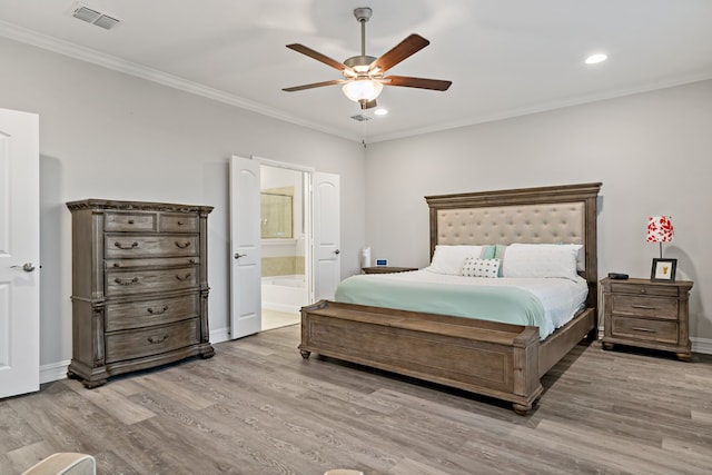 bedroom with ensuite bathroom, light hardwood / wood-style flooring, ceiling fan, and crown molding