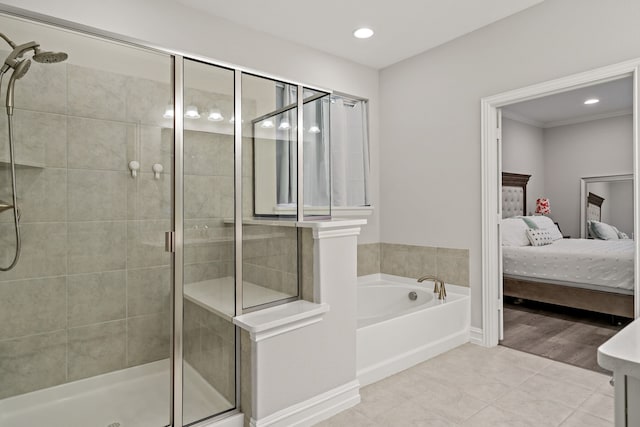 bathroom featuring hardwood / wood-style floors and separate shower and tub