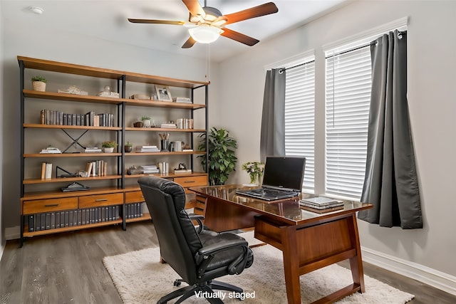 office area featuring dark hardwood / wood-style flooring and ceiling fan