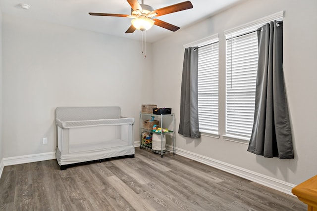 bedroom featuring hardwood / wood-style flooring and ceiling fan