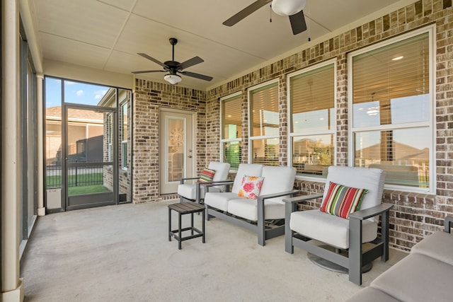 sunroom / solarium featuring ceiling fan