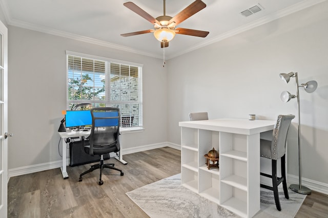 office space featuring hardwood / wood-style flooring, ceiling fan, and ornamental molding