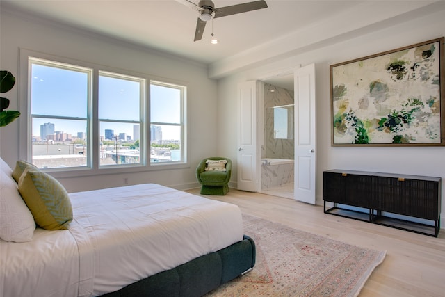 bedroom with ensuite bath, crown molding, ceiling fan, and light hardwood / wood-style floors