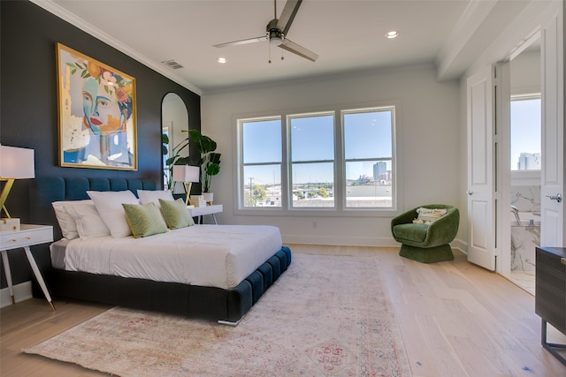 bedroom featuring ensuite bath, ceiling fan, crown molding, and light hardwood / wood-style flooring