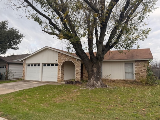 single story home with a front yard and a garage