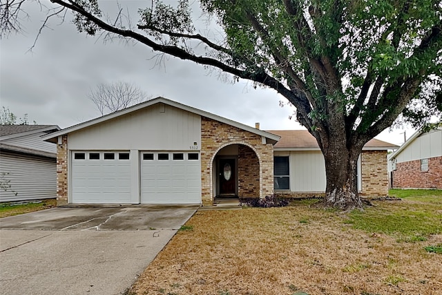 ranch-style house with a garage and a front yard