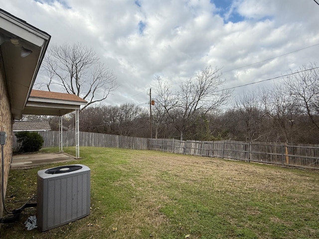 view of yard featuring central air condition unit