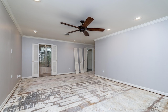 empty room featuring ceiling fan and ornamental molding