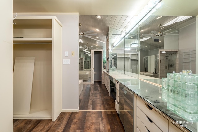 bathroom with hardwood / wood-style floors, vanity, independent shower and bath, and beverage cooler