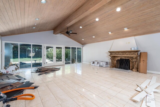 living room with ceiling fan, french doors, wooden ceiling, vaulted ceiling with beams, and a high end fireplace